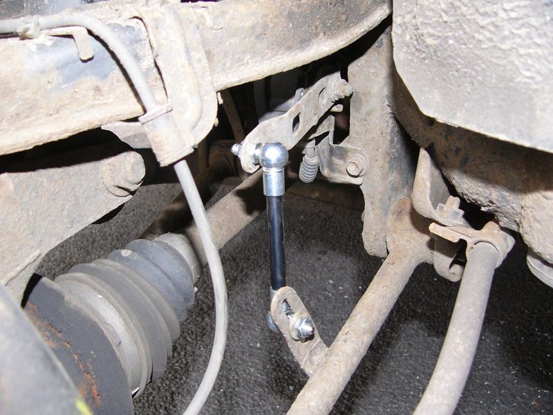 A closeup view of the new ride height sensor connector rod in situ